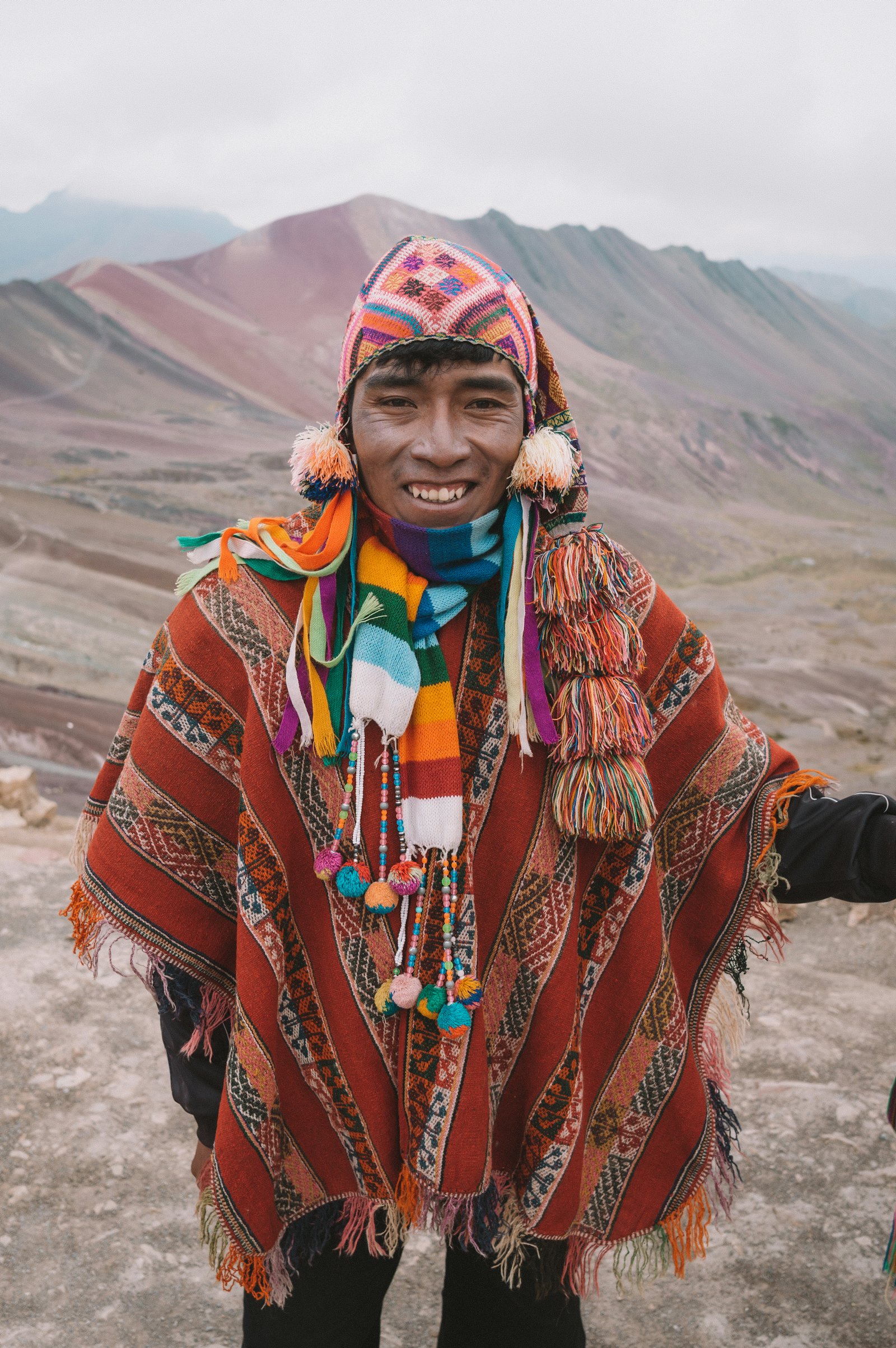 A young man in a traditional poncho