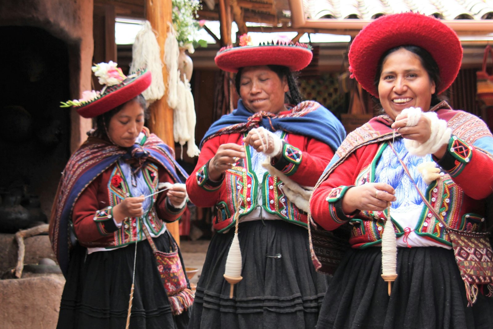 Community weavers spinning wool